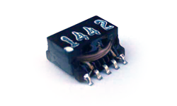 Coiltron 1442 surface-mount gate drive transformer featuring a black low-profile housing and silver gull-wing leads for PCB assembly.