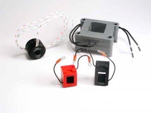 A collection of Coiltron custom magnetics including a toroidal current transformer with twisted leads, a large grey encapsulated assembly (5150181-A), and two small potted rectangular sensors in red and black with terminal leads.