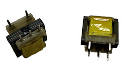 Two Coiltron through-hole PCB transformers with yellow insulation tape, black ferrite cores, and silver mounting pins.
